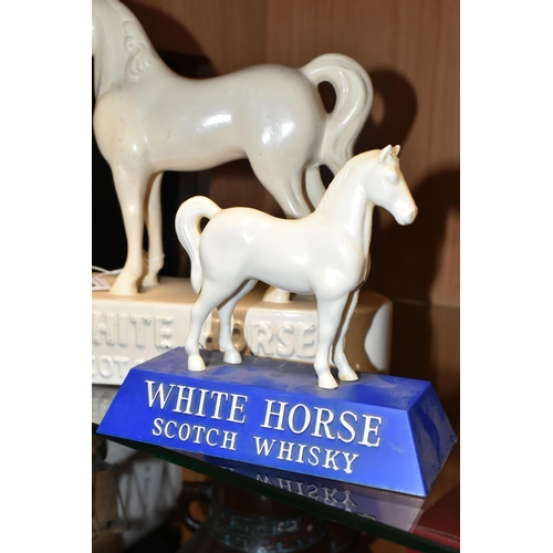 368 - TWO WHITE HORSE SCOTCH WHISKY ADVERTISING FIGURES, comprising a white ceramic Kelsboro Ware white ho... 