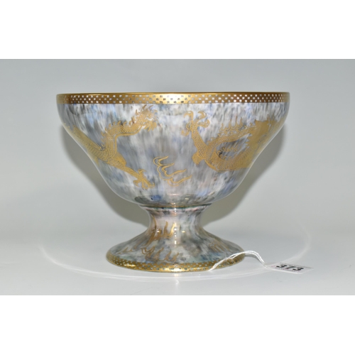 373 - A WEDGWOOD DRAGON LUSTRE WARE PEDESTAL BOWL,  in pattern no Z4831, the interior decorated with a red... 