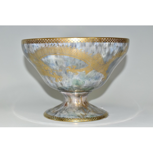 373 - A WEDGWOOD DRAGON LUSTRE WARE PEDESTAL BOWL,  in pattern no Z4831, the interior decorated with a red... 