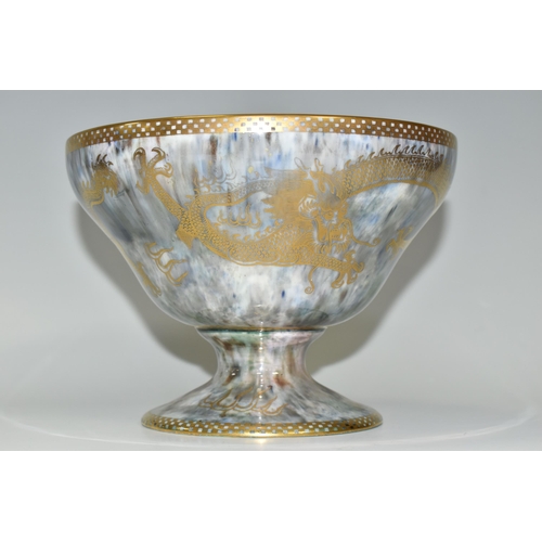 373 - A WEDGWOOD DRAGON LUSTRE WARE PEDESTAL BOWL,  in pattern no Z4831, the interior decorated with a red... 