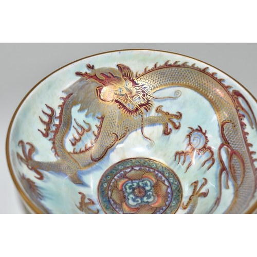 373 - A WEDGWOOD DRAGON LUSTRE WARE PEDESTAL BOWL,  in pattern no Z4831, the interior decorated with a red... 