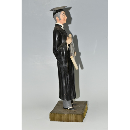 381 - A TEACHER'S SCOTCH WHISKY ADVERTISING FIGURE, the rubberoid figure in the form of a teacher holding ... 