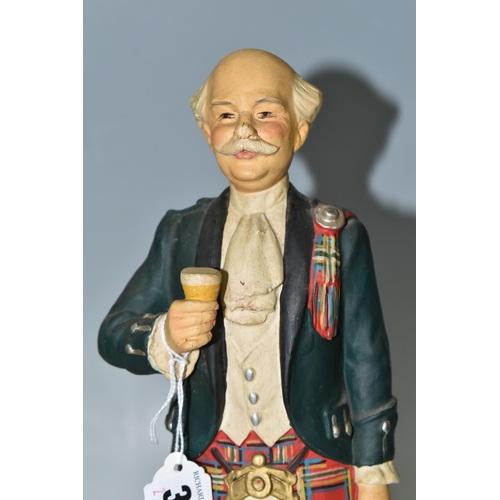 384 - TWO WHISKY ADVERTISING FIGURES, comprising  a rubberoid 'Currie's No 10 Perth Whisky' advertising fi... 