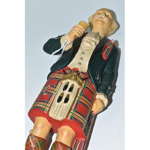 384 - TWO WHISKY ADVERTISING FIGURES, comprising  a rubberoid 'Currie's No 10 Perth Whisky' advertising fi... 