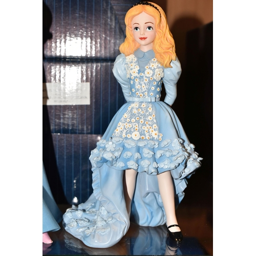 392 - FOUR BOXED ENESCO DISNEY SHOWCASE COLLECTION FIGURES, comprising Belle no 4058293, Cinderella no 600... 