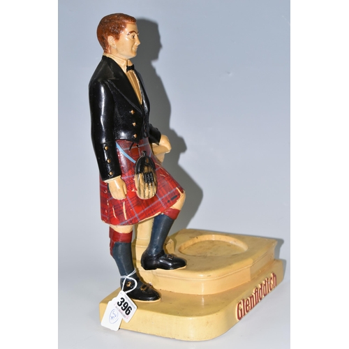 396 - A GLENFIDDICH SCOTCH WHISKY ADVERTISING FIGURE, the chalkware figure in the form of a Scotsman leani... 