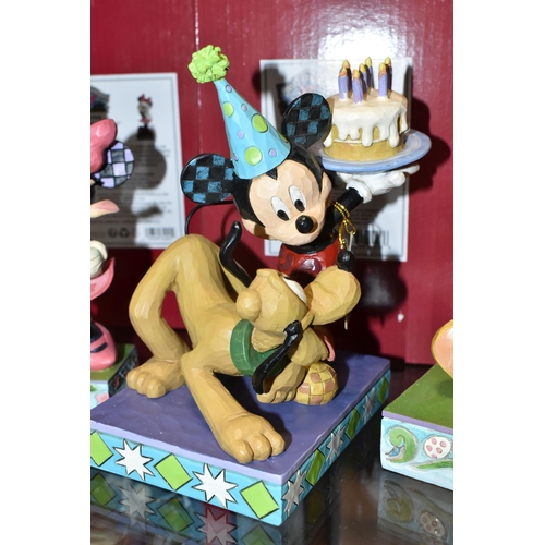 400 - FOUR BOXED ENESCO DISNEY TRADITIONS FIGURES, designed by Jim Shore, comprising Easter Artistry no 60... 