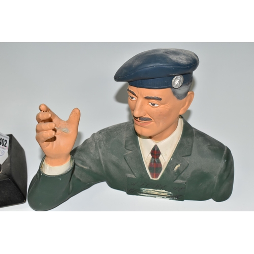 402 - TWO WHISKY ADVERTISING FIGURES, comprising a rubberoid 'Old Smuggler' advertising figure depicting a... 