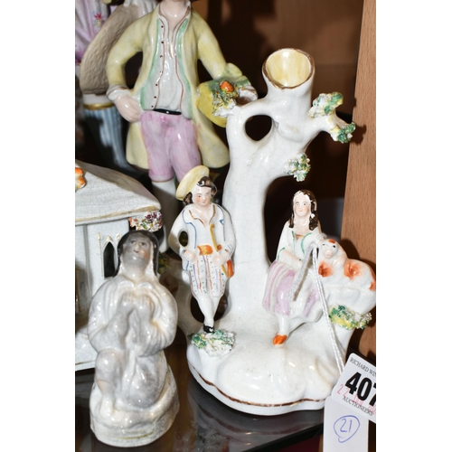 407 - A COLLECTION OF NINETEENTH CENTURY STAFFORDSHIRE AND SIMILAR FIGURES, to include a treacle glazed To... 