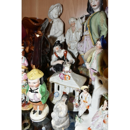 407 - A COLLECTION OF NINETEENTH CENTURY STAFFORDSHIRE AND SIMILAR FIGURES, to include a treacle glazed To... 