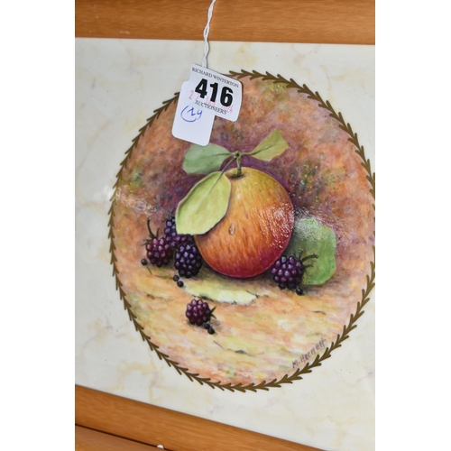 416 - TWO FRAMED HAND PAINTED CERAMIC PLAQUES, signed M. Harnett, painted with fruit in a central circular... 