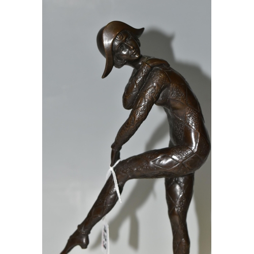 423 - AFTER DEMETRE CHIPARUS, A BRONZE 'HARLEQUIN' FIGURE, modelled glancing over her shoulder, standing o... 