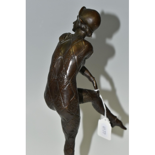 423 - AFTER DEMETRE CHIPARUS, A BRONZE 'HARLEQUIN' FIGURE, modelled glancing over her shoulder, standing o... 