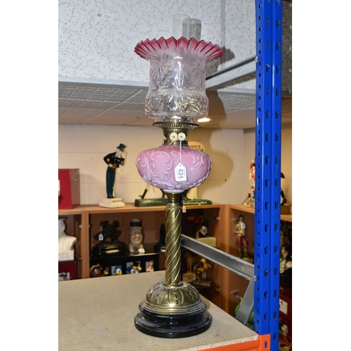 434 - A TALL VICTORIAN BRASS OIL LAMP, with a pink glass reservoir, clear to cranberry frilled shade, Dupl... 