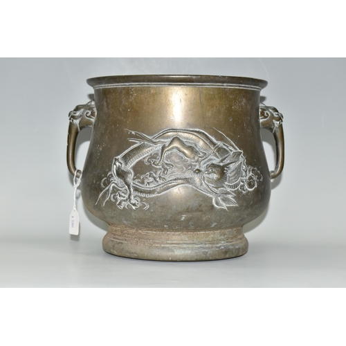 435 - AN ORIENTAL BRONZE PLANTER, decorated with a repoussé Japanese three clawed dragon on two sides and ... 