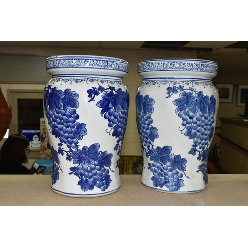 438 - A PAIR OF CHINESE BLUE AND WHITE PORCELAIN GARDEN SEATS, decorated overall with grapes and vines, pi... 