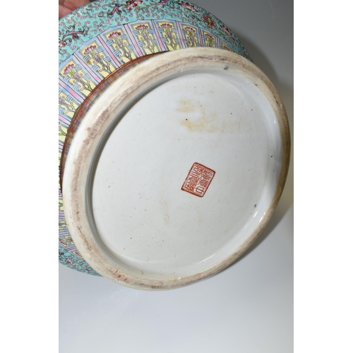 449 - A CHINESE TURQUOISE FAMILLE ROSE PORCELAIN VASE, decorated around the centre by four panels depictin... 