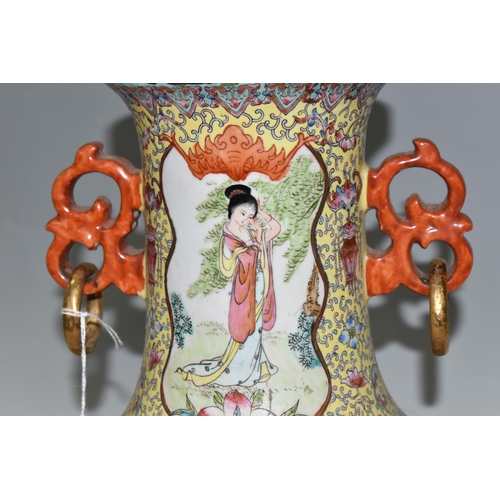 449 - A CHINESE TURQUOISE FAMILLE ROSE PORCELAIN VASE, decorated around the centre by four panels depictin... 