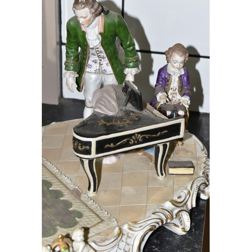 461 - A SITZENDORF PORCELAIN FIGURE GROUP, depicting the six year old Mozart playing piano for a group inc... 