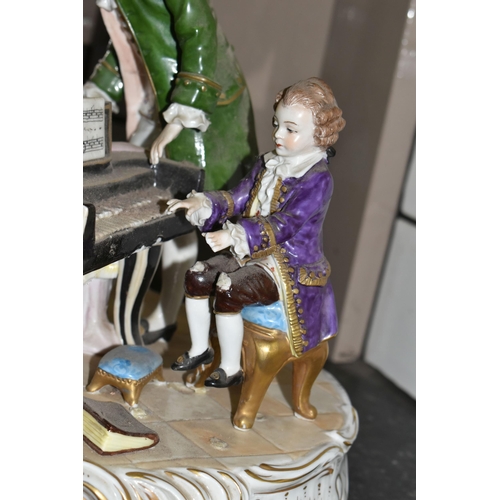 461 - A SITZENDORF PORCELAIN FIGURE GROUP, depicting the six year old Mozart playing piano for a group inc... 