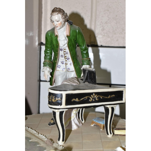 461 - A SITZENDORF PORCELAIN FIGURE GROUP, depicting the six year old Mozart playing piano for a group inc... 