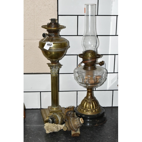 462 - TWO VICTORIAN OIL LAMPS AND THREE SPARE BURNERS, comprising three brass oil lamp burners complete wi... 