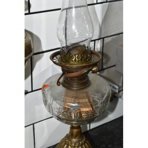 462 - TWO VICTORIAN OIL LAMPS AND THREE SPARE BURNERS, comprising three brass oil lamp burners complete wi... 