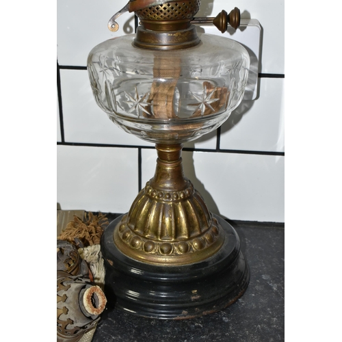 462 - TWO VICTORIAN OIL LAMPS AND THREE SPARE BURNERS, comprising three brass oil lamp burners complete wi... 