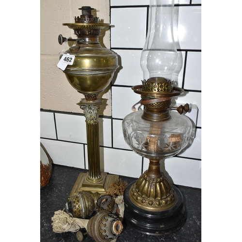 462 - TWO VICTORIAN OIL LAMPS AND THREE SPARE BURNERS, comprising three brass oil lamp burners complete wi... 