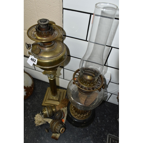 462 - TWO VICTORIAN OIL LAMPS AND THREE SPARE BURNERS, comprising three brass oil lamp burners complete wi... 