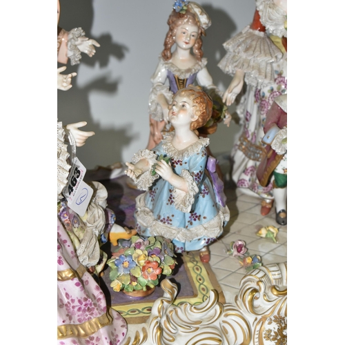 463 - A DRESDEN FIGURE GROUP, an early 20th century German porcelain figure group depicting a joyful famil... 