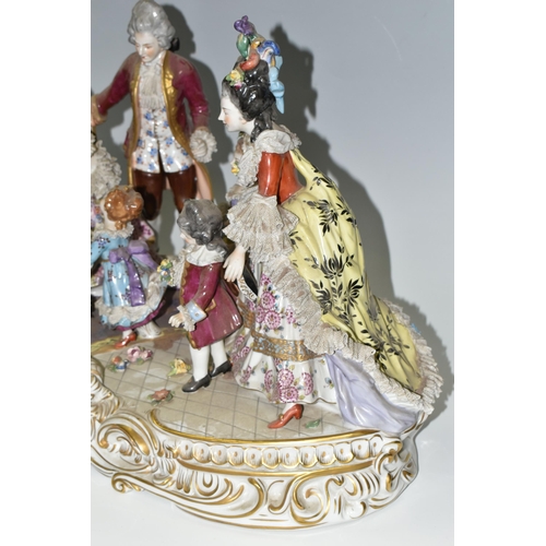 463 - A DRESDEN FIGURE GROUP, an early 20th century German porcelain figure group depicting a joyful famil... 