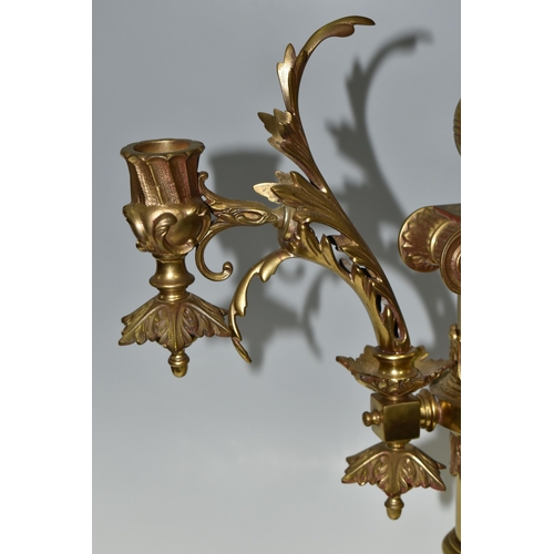 469 - A LARGE BRASS FIGURAL TABLE LAMP, with three bulb fittings at the top, brass gimble and two flame fo... 