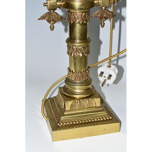 469 - A LARGE BRASS FIGURAL TABLE LAMP, with three bulb fittings at the top, brass gimble and two flame fo... 