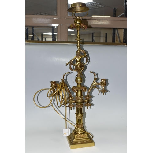 469 - A LARGE BRASS FIGURAL TABLE LAMP, with three bulb fittings at the top, brass gimble and two flame fo... 