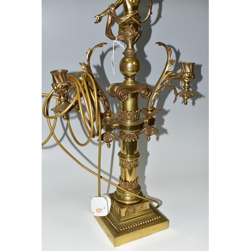 469 - A LARGE BRASS FIGURAL TABLE LAMP, with three bulb fittings at the top, brass gimble and two flame fo... 