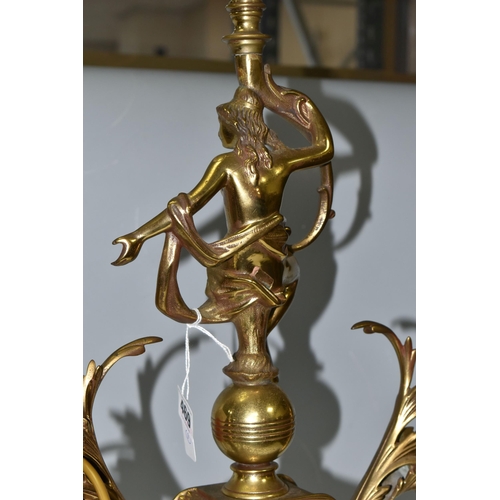 469 - A LARGE BRASS FIGURAL TABLE LAMP, with three bulb fittings at the top, brass gimble and two flame fo... 