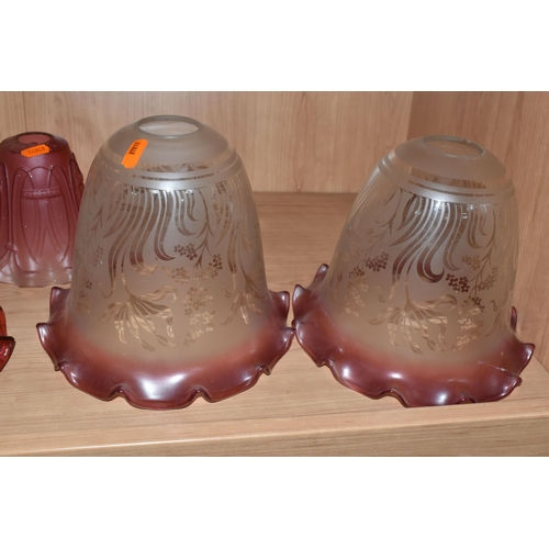 472 - A GROUP OF NINE GLASS ART DECO LAMP SHADES, comprising a pair of acid etched clear to cranberry shad... 