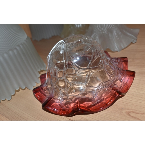 472 - A GROUP OF NINE GLASS ART DECO LAMP SHADES, comprising a pair of acid etched clear to cranberry shad... 