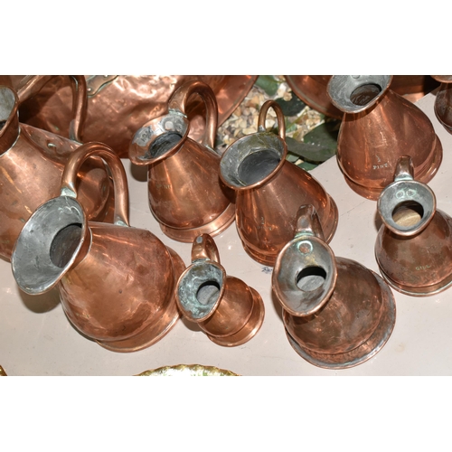 533 - SIXTEEN COPPER JUGS, stamped with measurements, from 1/2 Gill to 5 Gallons, and weights and measures... 