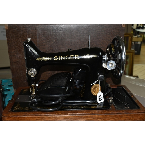 545 - A SINGER ELECTRIC SEWING MACHINE, Serial No.EB417318, not tested, appears in good condition, missing... 