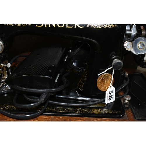 545 - A SINGER ELECTRIC SEWING MACHINE, Serial No.EB417318, not tested, appears in good condition, missing... 