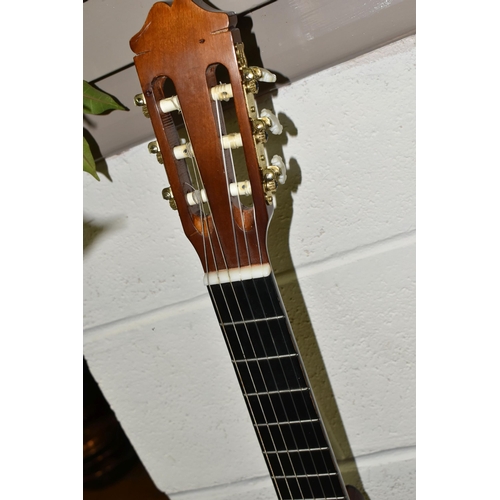 553 - THREE ACOUSTIC GUITARS, comprising a Hokada guitar model 3182 (some chips and knocks to edges, part ... 