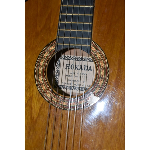 553 - THREE ACOUSTIC GUITARS, comprising a Hokada guitar model 3182 (some chips and knocks to edges, part ... 