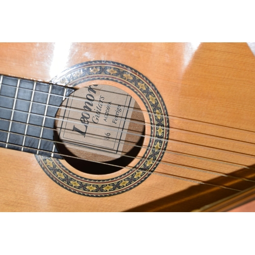 553 - THREE ACOUSTIC GUITARS, comprising a Hokada guitar model 3182 (some chips and knocks to edges, part ... 