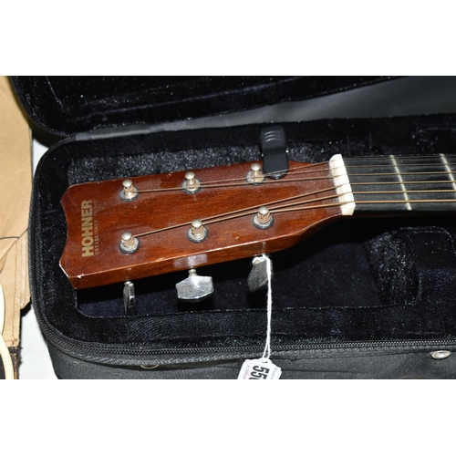 556 - A CASED HOHNER GUITAR, model no MW 400N, in a Stagg guitar case with 'The Complete Guitar Player: Bo... 