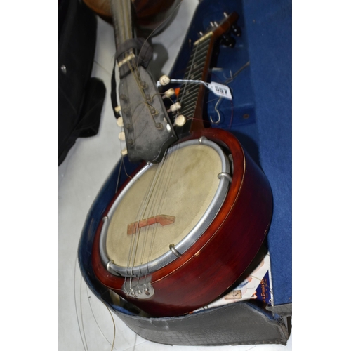 557 - A MANDOLIN AND BANJULELE BANJO, comprising mandolin with inlaid details and homemade shoulder strap ... 