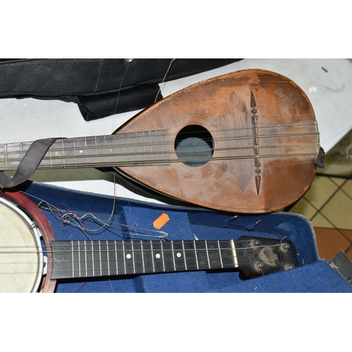 557 - A MANDOLIN AND BANJULELE BANJO, comprising mandolin with inlaid details and homemade shoulder strap ... 