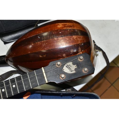 557 - A MANDOLIN AND BANJULELE BANJO, comprising mandolin with inlaid details and homemade shoulder strap ... 