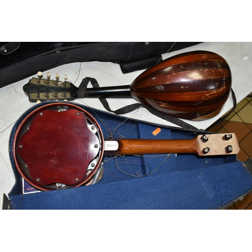 557 - A MANDOLIN AND BANJULELE BANJO, comprising mandolin with inlaid details and homemade shoulder strap ... 